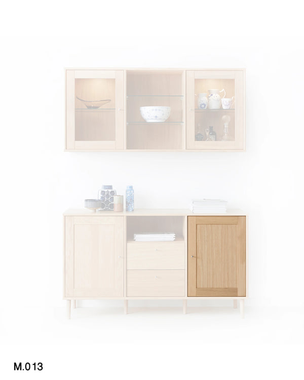 A modern light wood sideboard cabinet with a matching wall-mounted upper cabinet, shown on a white background. The lower cabinet features a light beige wood finish, a darker natural wood door, and glass-front upper sections.