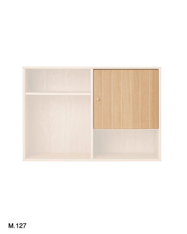 A wall-mounted storage cabinet with a light wood grain finish, featuring an open shelf on the left, a lower open compartment on the right, and a single light wood door with a small round knob on the upper right section.